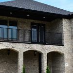 luxury home with second floor balcony